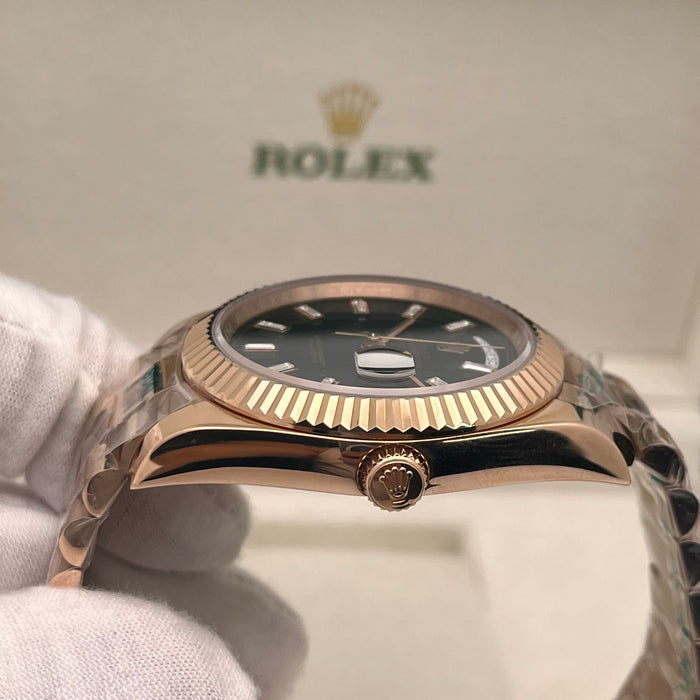Rolex Day-Date II 41mm Rose Gold black index dial paired with a fluted bezel.