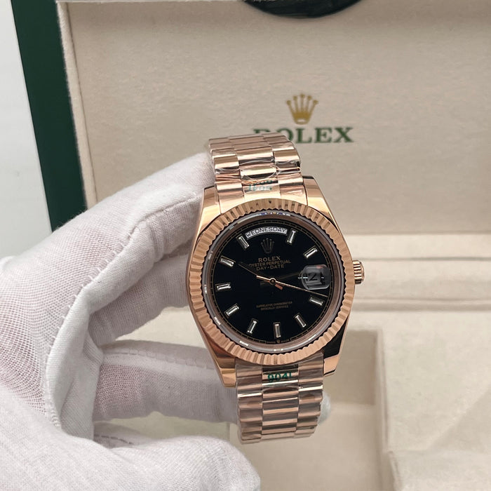 Rolex Day-Date II 41mm Rose Gold black index dial paired with a fluted bezel.