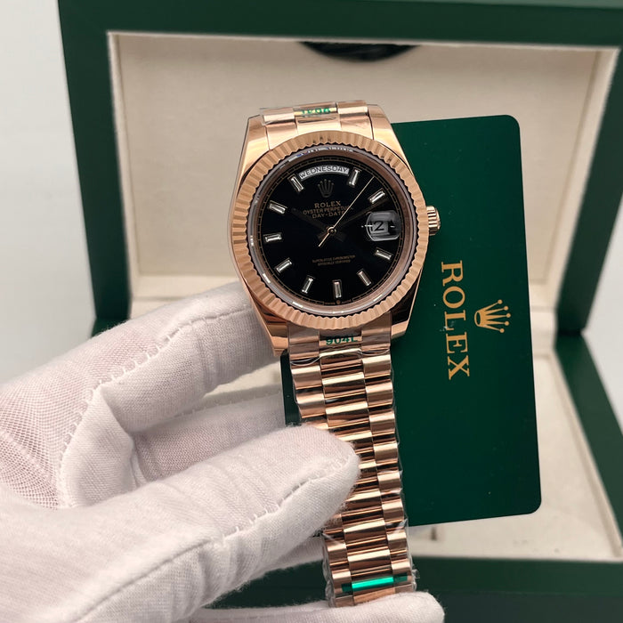 Rolex Day-Date II 41mm Rose Gold black index dial paired with a fluted bezel.