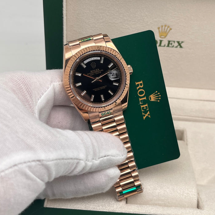 Rolex Day-Date II 41mm Rose Gold black index dial paired with a fluted bezel.