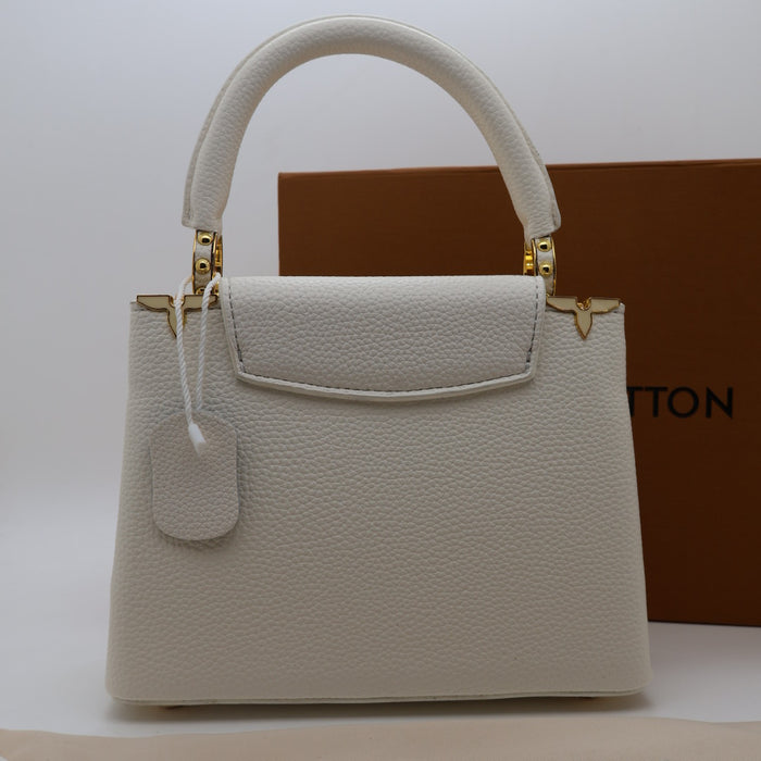 Louis Vuitton Capucines Small Bag in Grained Leather with Gold LV Detail