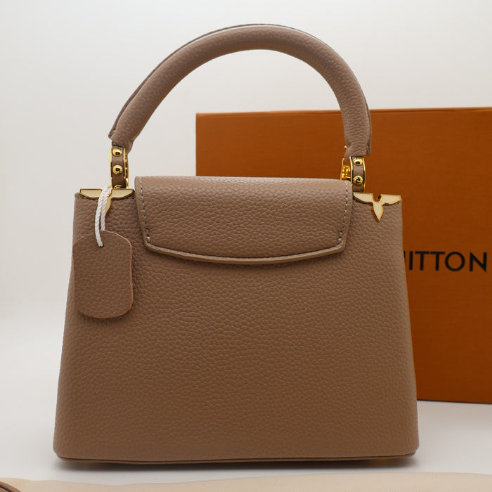 Louis Vuitton Capucines Small Bag in Grained Leather with Gold LV Detail
