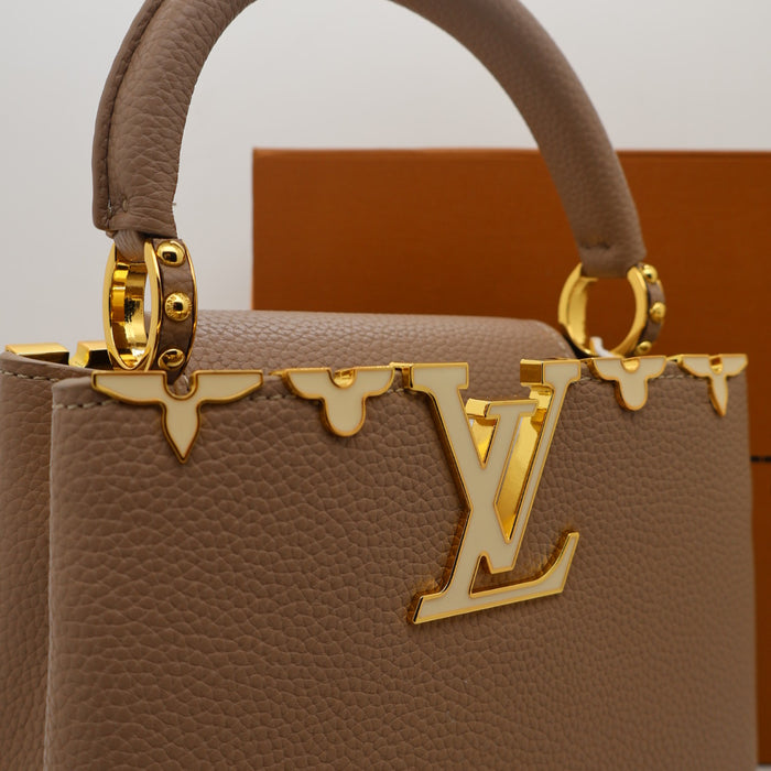 Louis Vuitton Capucines Small Bag in Grained Leather with Gold LV Detail