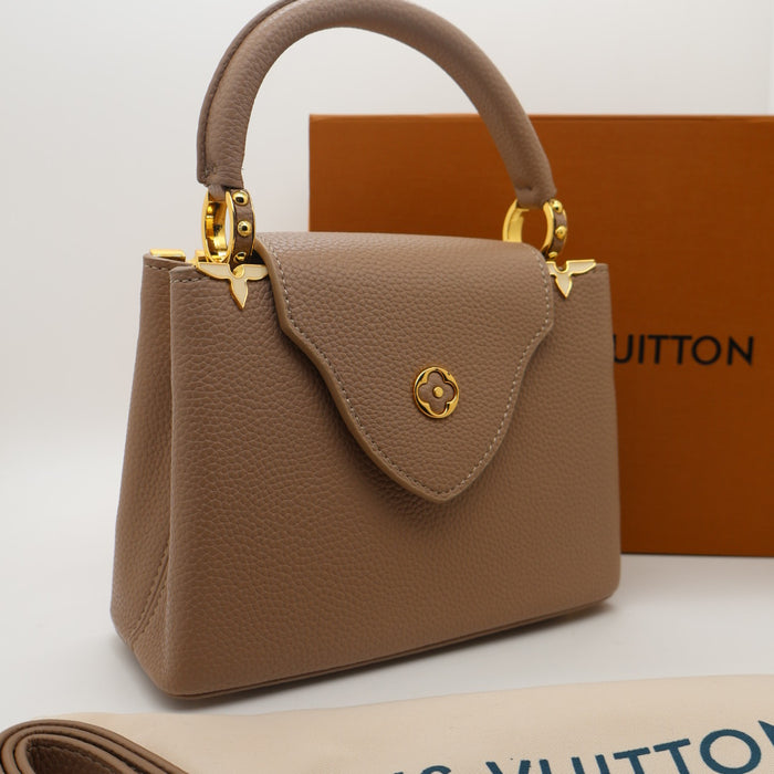Louis Vuitton Capucines Small Bag in Grained Leather with Gold LV Detail