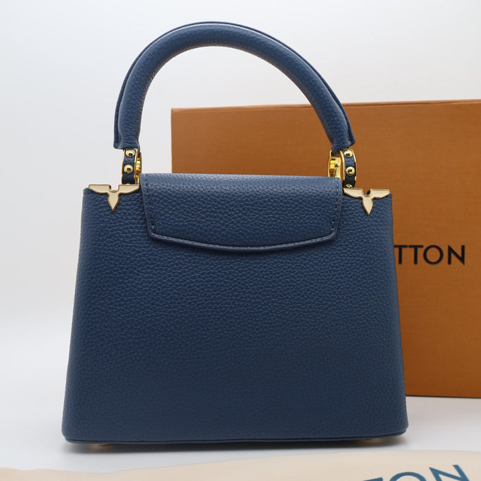 Louis Vuitton Capucines Small Bag in Grained Leather with Gold LV Detail